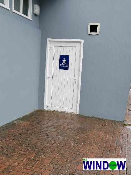 White uPVC door fitted to Caswell Bay Toilets