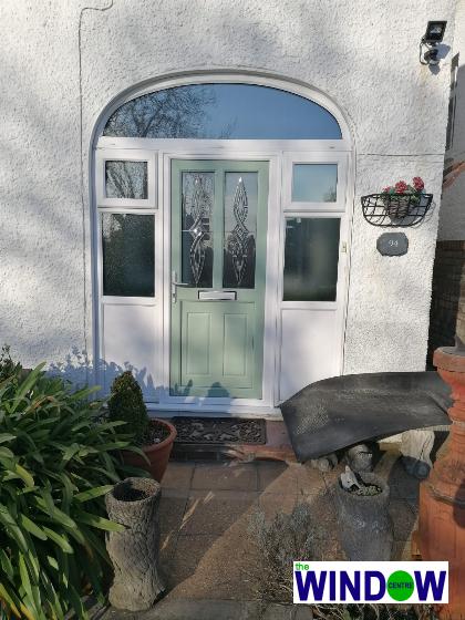 Chartwell Green uPVC door with arched frame and side windows