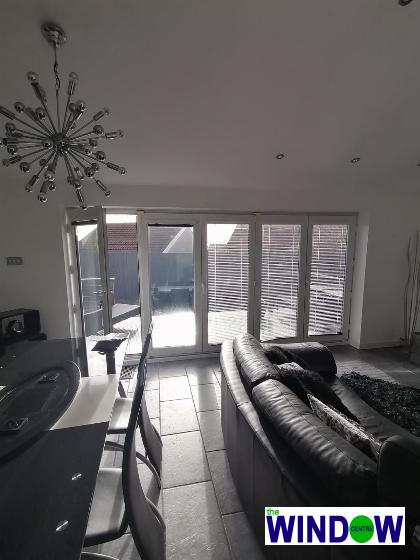 Bi-Folding doors in white interior